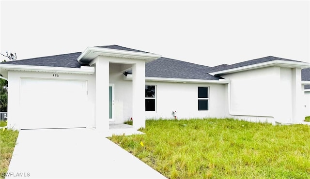 rear view of property with a garage