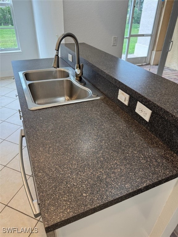 details with sink and light tile patterned flooring