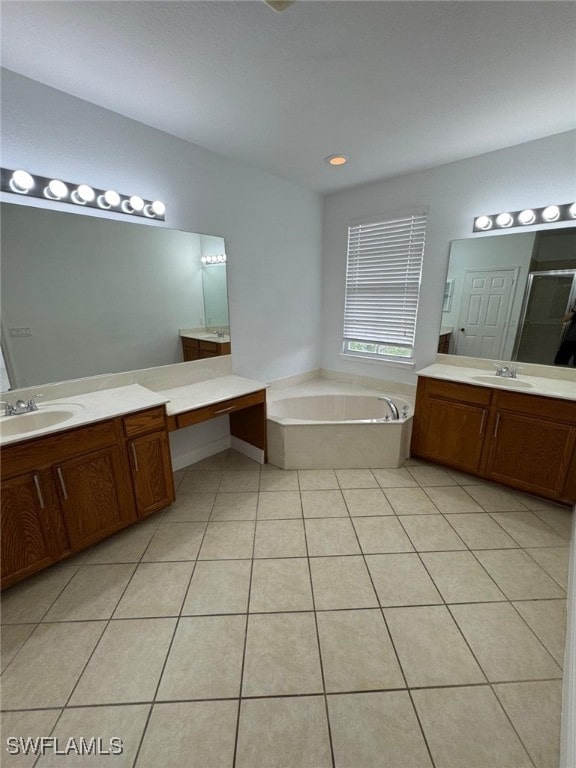 bathroom featuring vanity, independent shower and bath, and tile patterned flooring