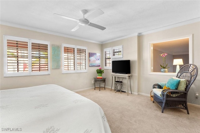 carpeted bedroom featuring ornamental molding and ceiling fan