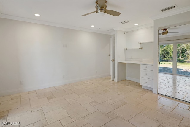 interior space featuring ceiling fan, built in desk, crown molding, and french doors