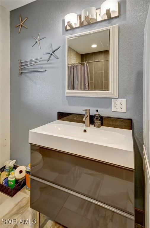 bathroom featuring vanity and walk in shower