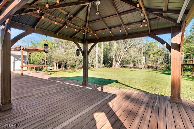 deck with a gazebo and a yard