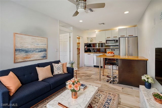 living room featuring ceiling fan