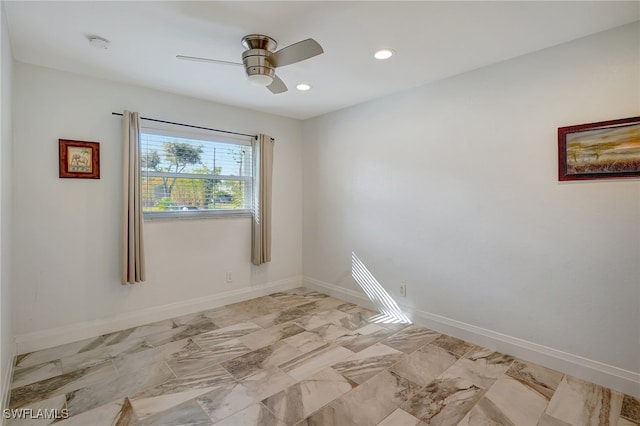 spare room with ceiling fan