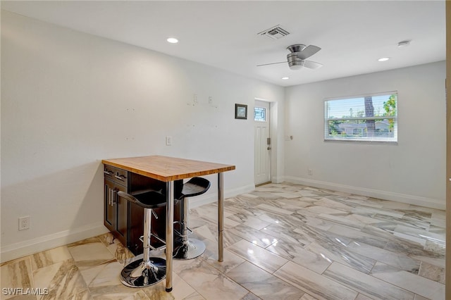 dining space featuring ceiling fan