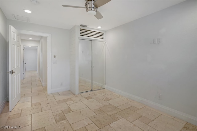 unfurnished bedroom featuring a closet, elevator, and ceiling fan