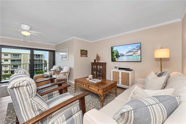 living room with ceiling fan, hardwood / wood-style floors, and ornamental molding