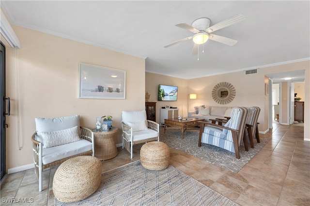 living room featuring ornamental molding, light tile patterned floors, and ceiling fan