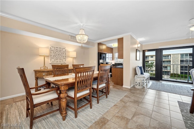 tiled dining space with ceiling fan with notable chandelier and crown molding