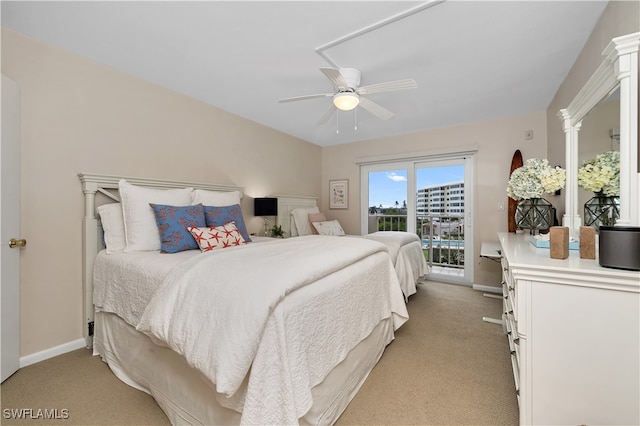 carpeted bedroom featuring access to outside and ceiling fan