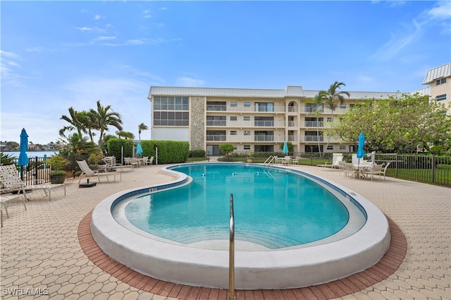 view of swimming pool featuring a patio area