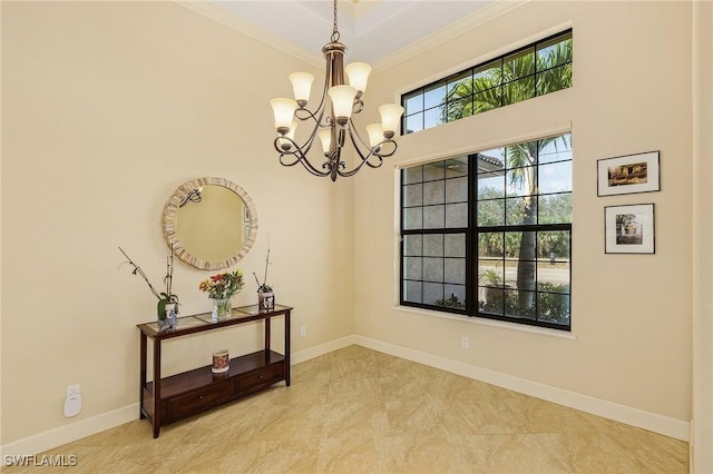 interior space featuring crown molding and a notable chandelier