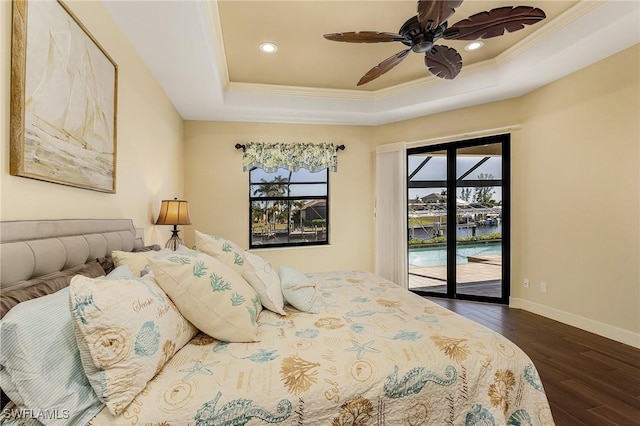 bedroom with dark wood-type flooring, access to outside, a raised ceiling, ceiling fan, and ornamental molding