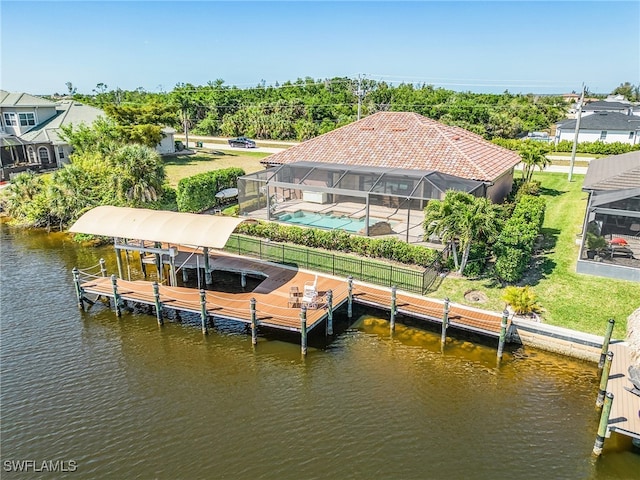 view of dock with glass enclosure, a yard, a fenced in pool, a patio area, and a water view