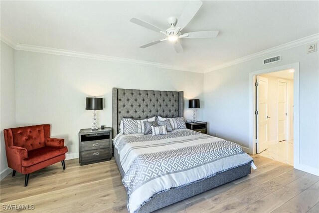 bedroom with ceiling fan, light hardwood / wood-style floors, and crown molding