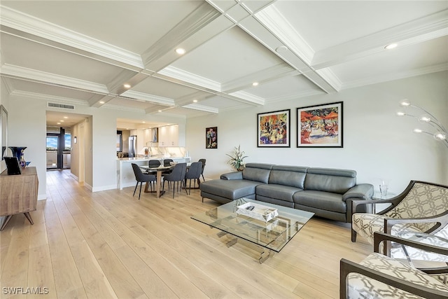 living room featuring light hardwood / wood-style flooring, beamed ceiling, crown molding, and coffered ceiling