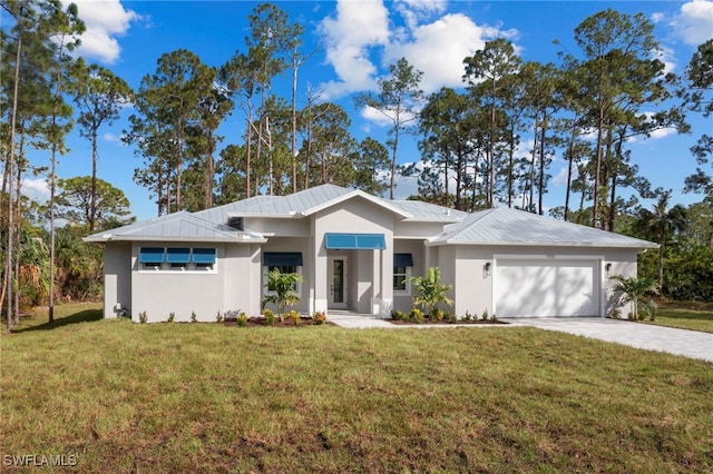 view of front of home with a garage and a front yard