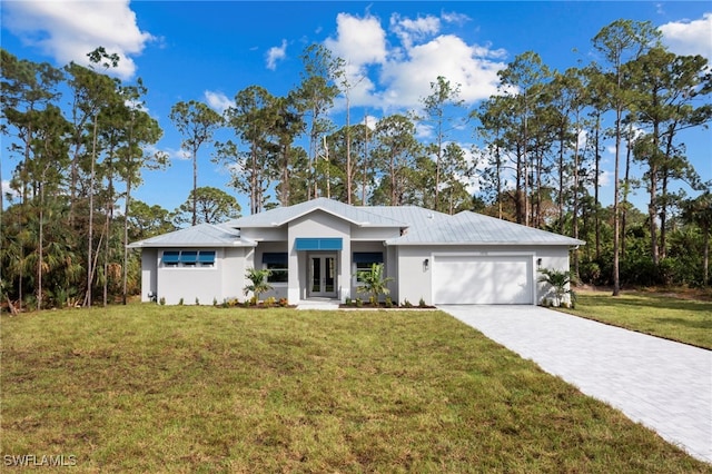 view of front of house featuring a front lawn and a garage