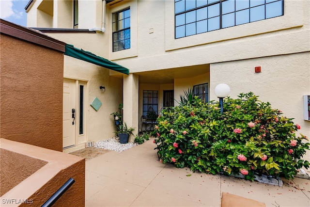 entrance to property with a patio