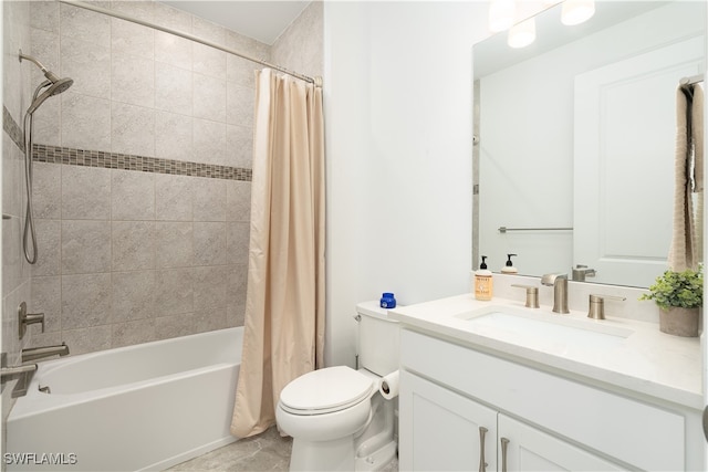 full bathroom featuring shower / bath combo, vanity, and toilet