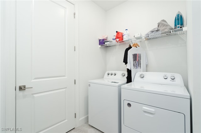 laundry area with washing machine and dryer