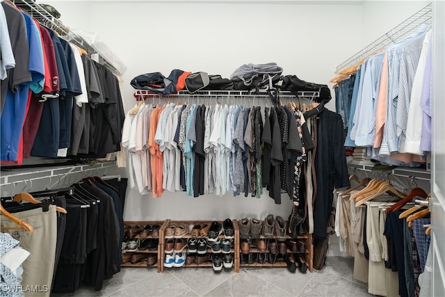 spacious closet featuring tile patterned floors