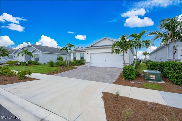 ranch-style home featuring a garage and a front yard