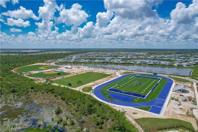 birds eye view of property with a water view