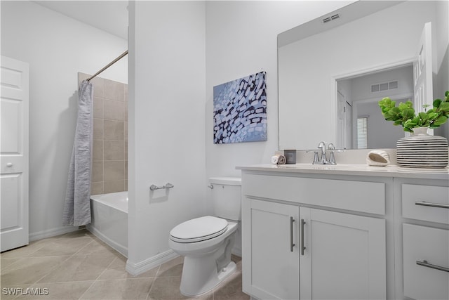 full bathroom featuring toilet, vanity, tile patterned floors, and shower / bath combo with shower curtain