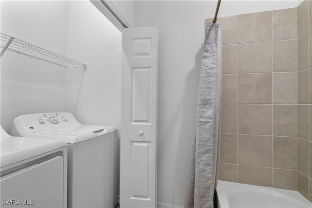 laundry room featuring washing machine and dryer