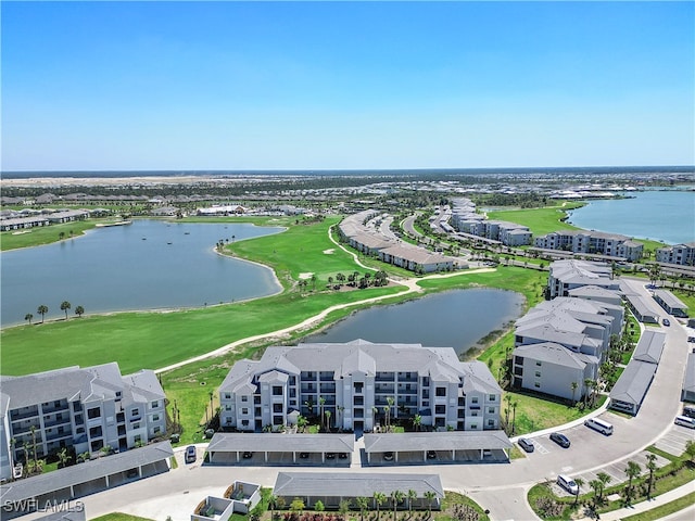 birds eye view of property with a water view