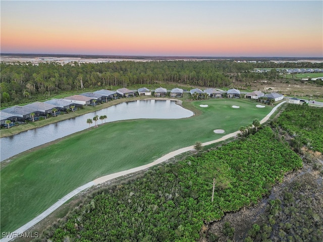 aerial view at dusk with a water view