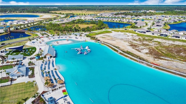 bird's eye view featuring a water view and a view of the beach