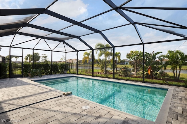 view of swimming pool with a lanai and a patio area