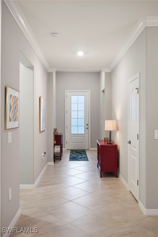 doorway featuring crown molding and light tile patterned flooring