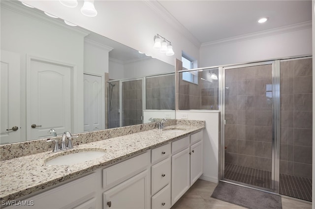 bathroom featuring walk in shower, tile patterned flooring, vanity, and ornamental molding