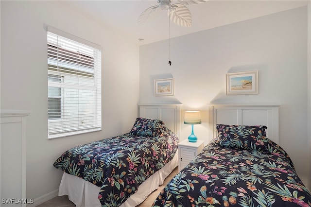 bedroom featuring ceiling fan and multiple windows