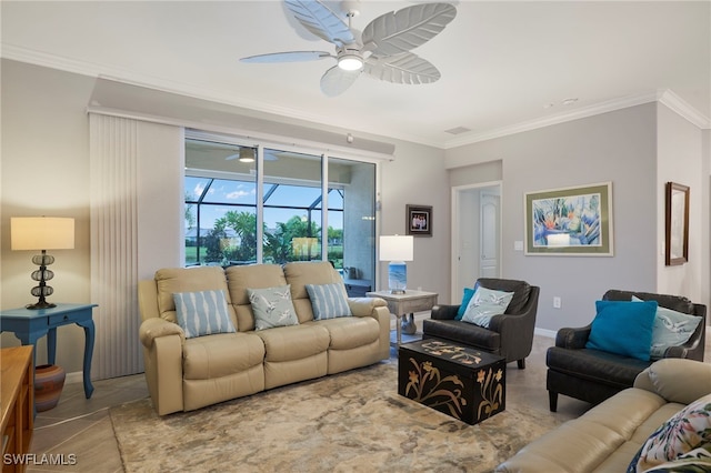 living room with ceiling fan and ornamental molding