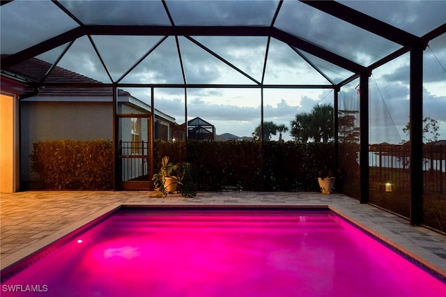 view of pool featuring a patio area and a lanai