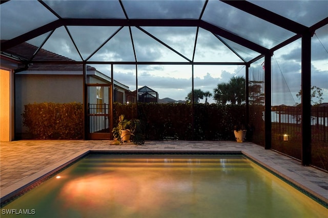 view of pool featuring a lanai and a patio area