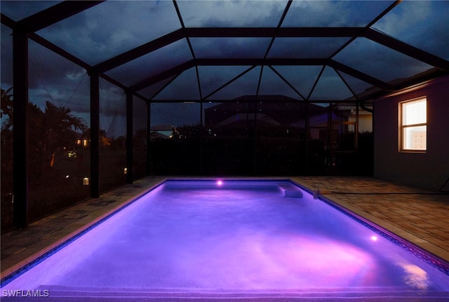 view of pool featuring a patio area and a lanai