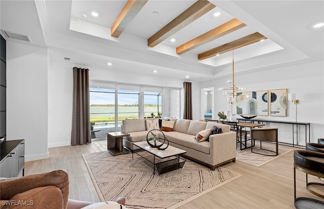 living room featuring light wood-type flooring, a chandelier, and beam ceiling