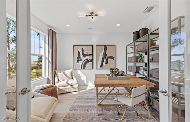 office area featuring french doors and light hardwood / wood-style flooring