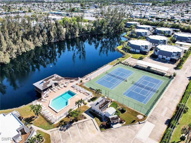 birds eye view of property with a water view