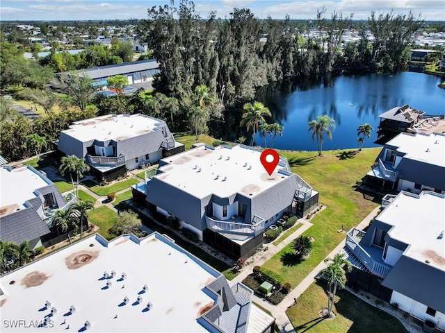 birds eye view of property with a water view