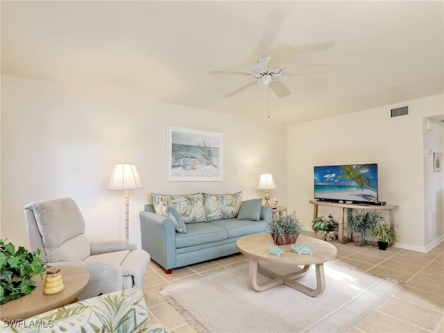 living room with ceiling fan and light tile patterned flooring