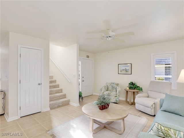 living room featuring ceiling fan and light tile patterned floors