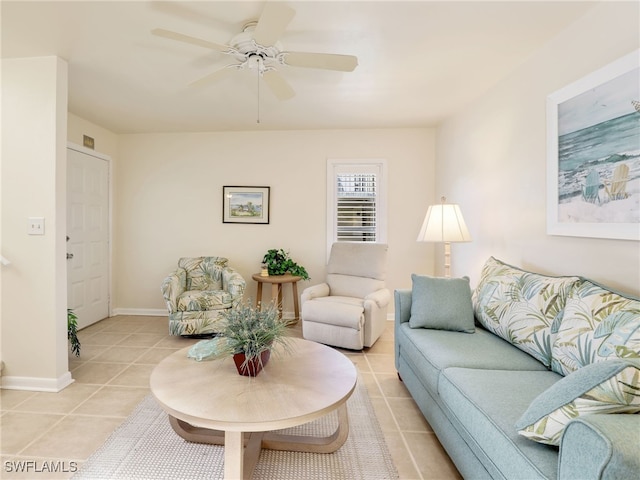 living room featuring ceiling fan and light tile patterned flooring