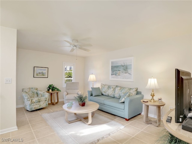 living room with ceiling fan and light tile patterned flooring